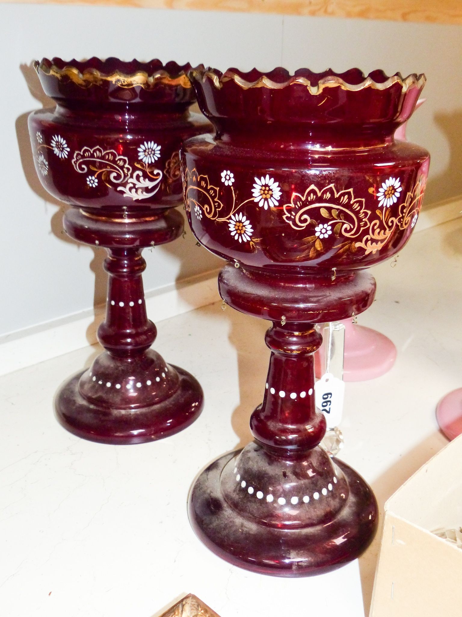 Two pairs of enamelled glass table lustres and another similar, late 19th century, tallest 36 cm